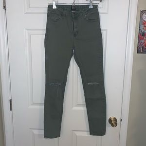 Army Green pants with ripped knees